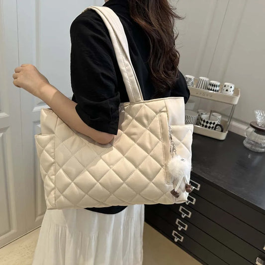 The Quilted Tote with Plush Charm